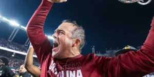 Shane Beamer, South Carolina Football’s Icon, Faces Backlash Over Clemson-Colored Hat During Heartfelt Father-Son Moment